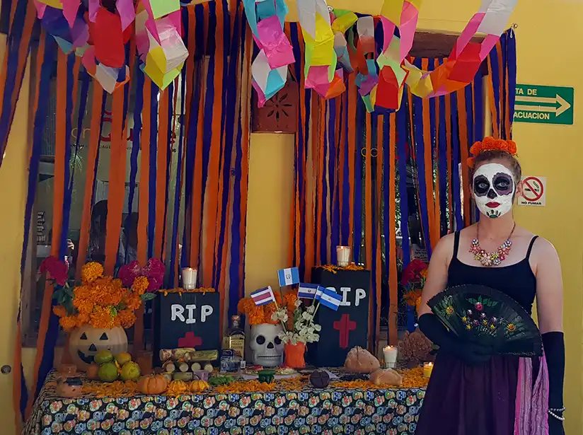 Catrina at a Dia de Muertos ofrenda