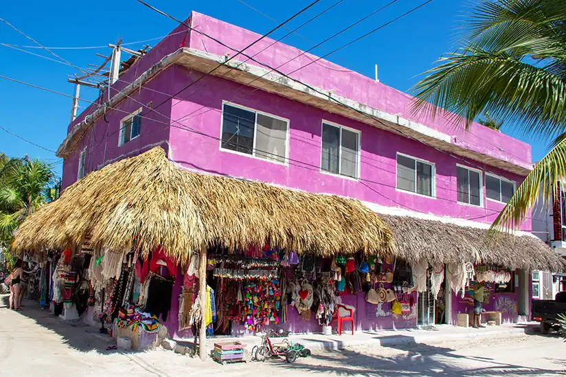 Pink building of the Artesania Madre Sagrada store in Holbox, a picturesque sight in the Caribbean.