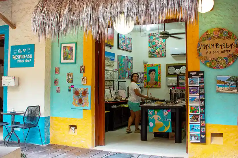 A saleswoman stands in the Mandala Art and Silver store in Holbox.